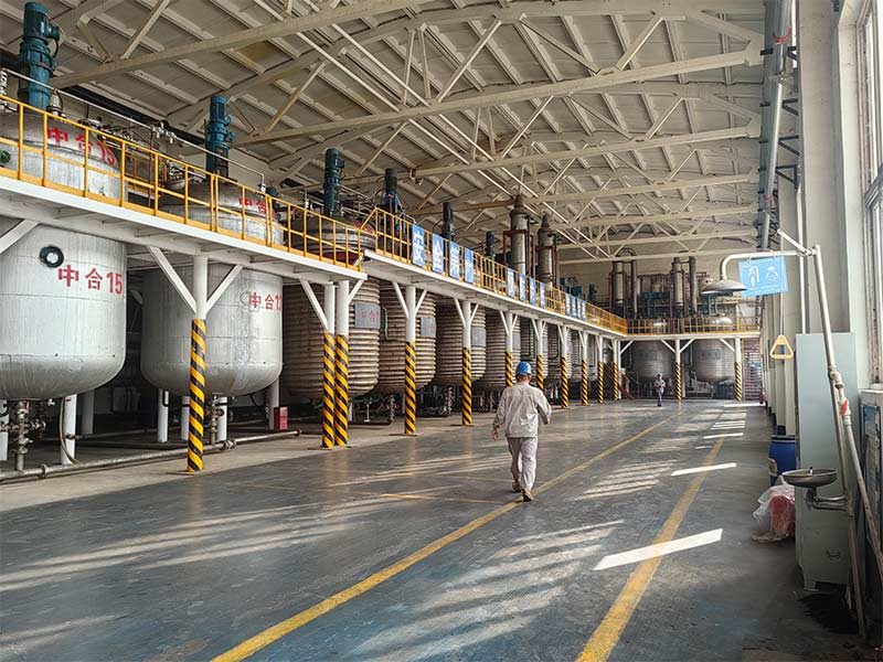 Industrial chemical production workshop with processing equipment and operating area