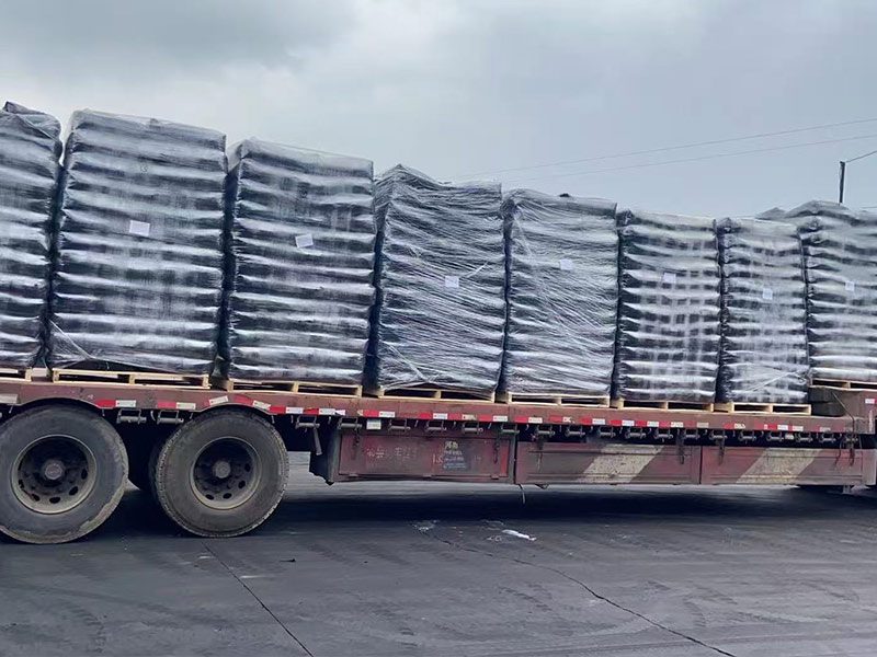 Palletized bags of carbon black prepared for truck transport